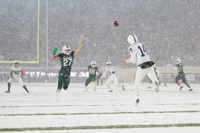 Penn State quarterback Sean Clifford throws a pass against Michigan State at Spartan Stadium in 2021.